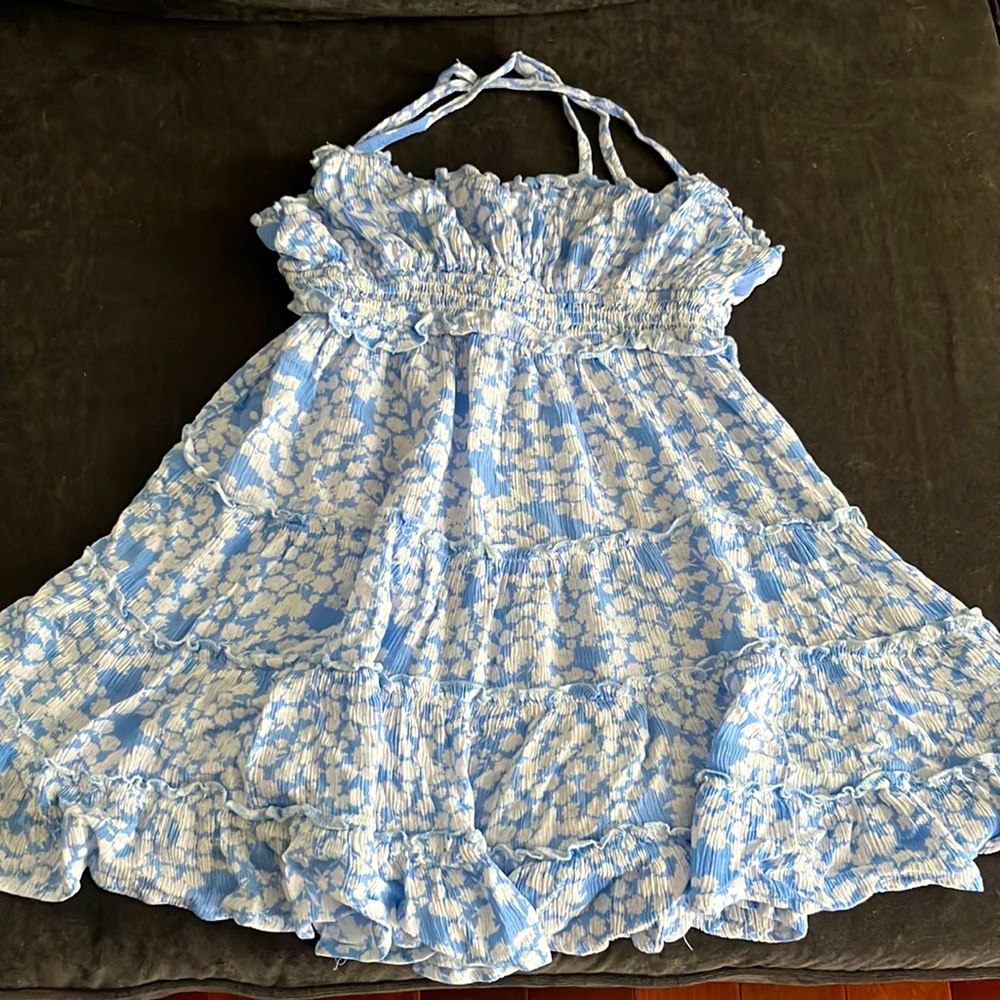 Soft, stretchy, short and breezy dress. Never worn. Cute crisscross back.